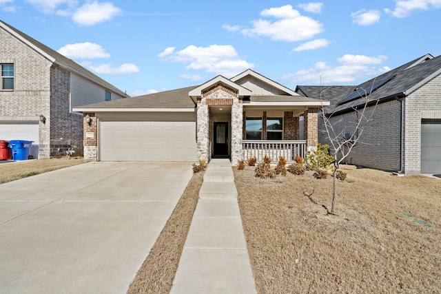 view of front of house featuring covered porch and a garage