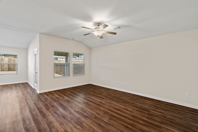 unfurnished room with dark wood-type flooring, vaulted ceiling, and ceiling fan