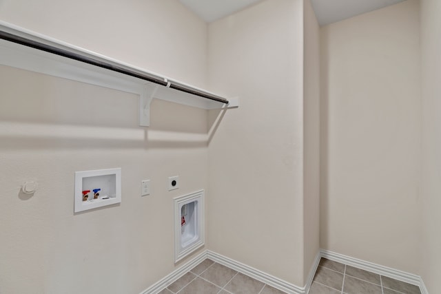 laundry room featuring washer hookup, gas dryer hookup, electric dryer hookup, and light tile patterned flooring