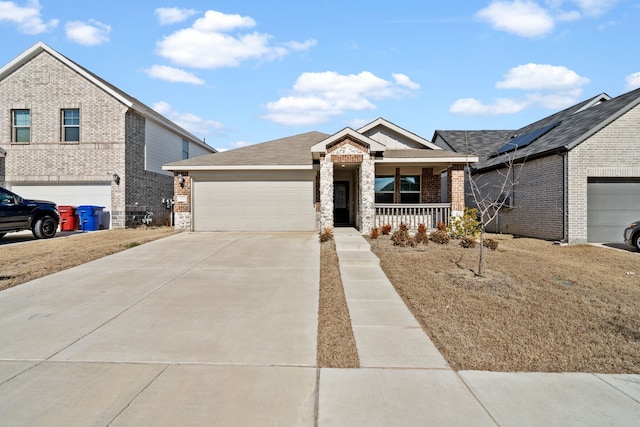 view of front of property featuring a porch and a garage