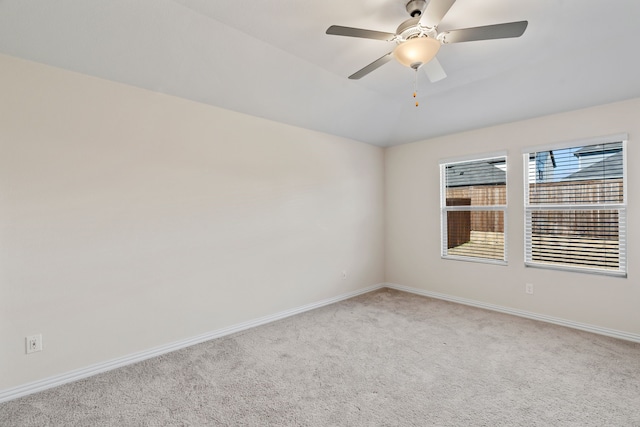 unfurnished room featuring ceiling fan and light carpet