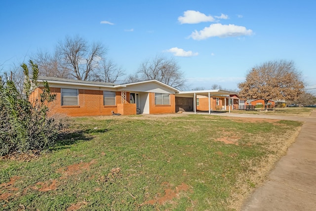 single story home featuring a front yard and a carport