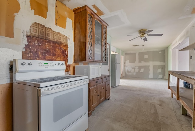 kitchen featuring white appliances and ceiling fan