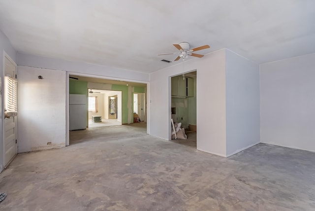 unfurnished bedroom with white refrigerator, a closet, and ceiling fan