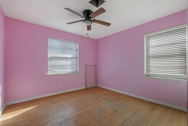 empty room with light wood-type flooring and ceiling fan