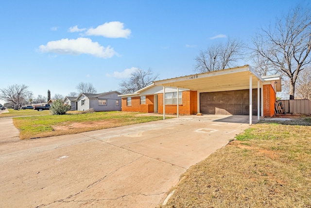 single story home with a front yard and a carport