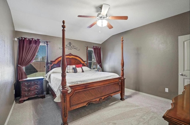 carpeted bedroom with lofted ceiling and ceiling fan