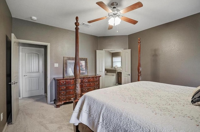 bedroom featuring ceiling fan and light carpet