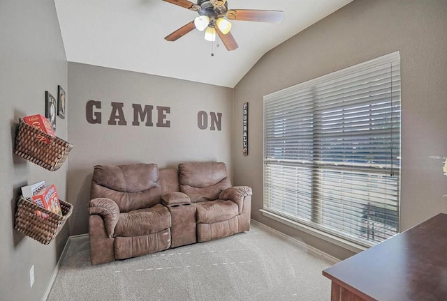 carpeted living room with vaulted ceiling and ceiling fan