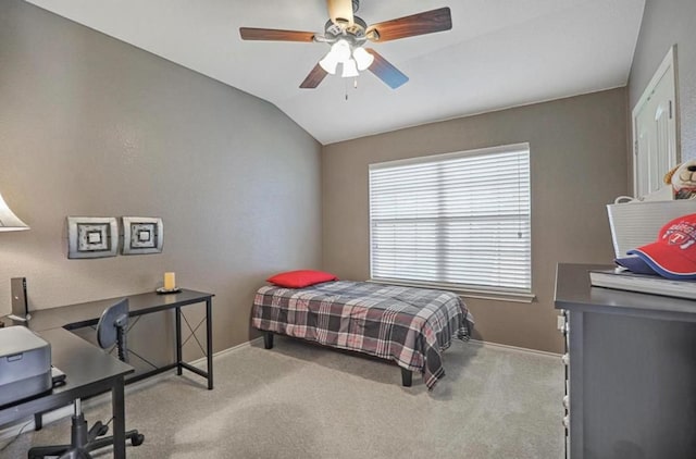 carpeted bedroom with vaulted ceiling and ceiling fan