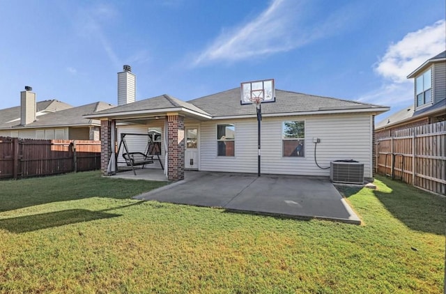 back of property with cooling unit, a yard, and a patio