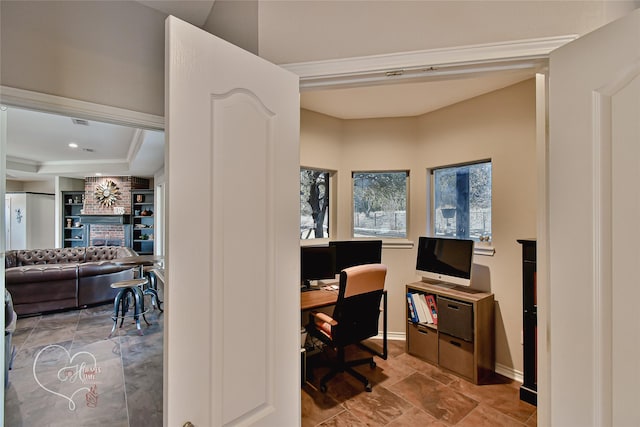 office area featuring a tray ceiling and built in features