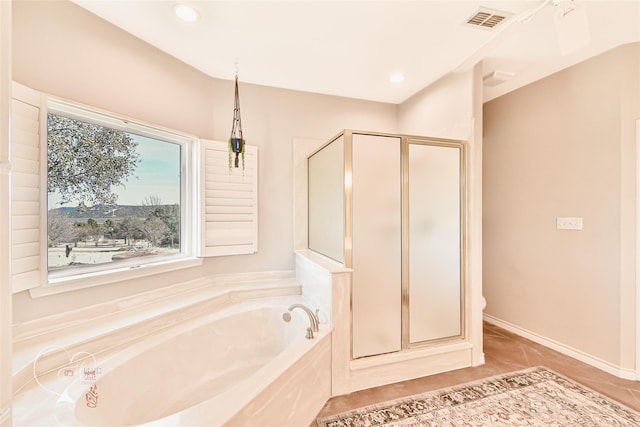 bathroom featuring separate shower and tub and tile patterned floors