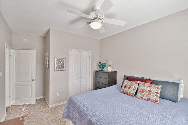 bedroom featuring a closet, ceiling fan, and light colored carpet