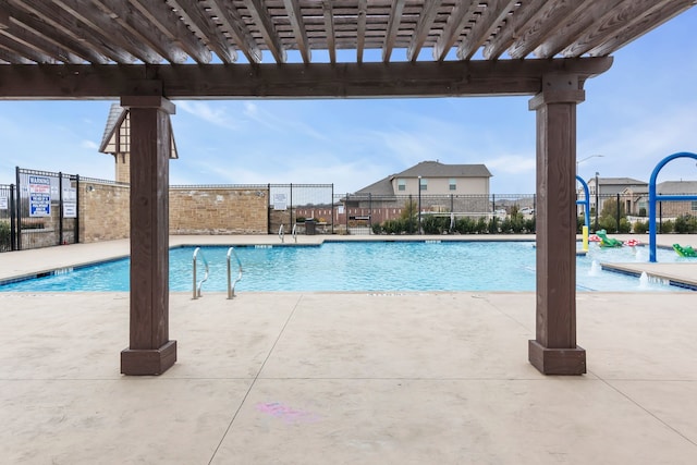 view of swimming pool with a patio