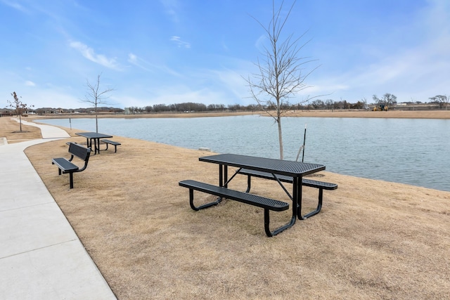 view of home's community with a water view