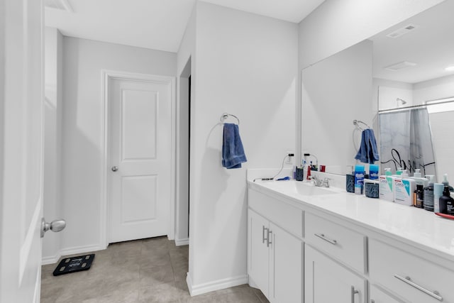 bathroom with vanity and a shower with shower curtain