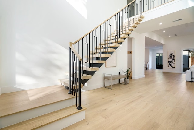 stairway featuring hardwood / wood-style flooring