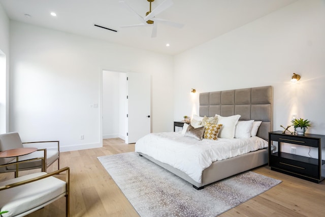 bedroom with ceiling fan and light hardwood / wood-style flooring