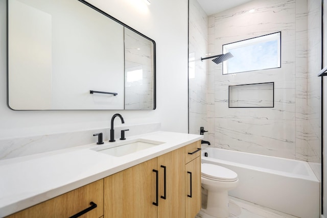 full bathroom featuring vanity, toilet, and tiled shower / bath