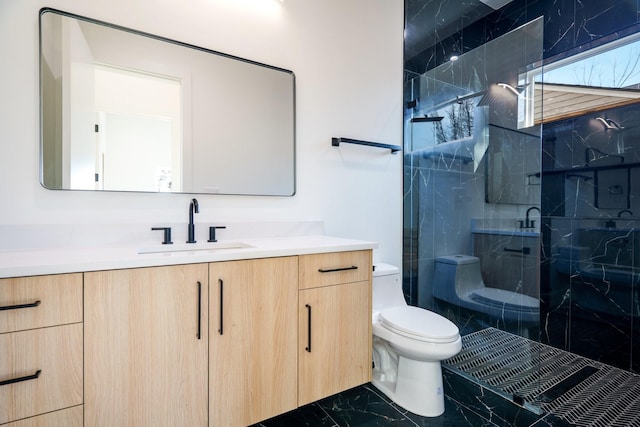 bathroom featuring vanity, toilet, and an enclosed shower