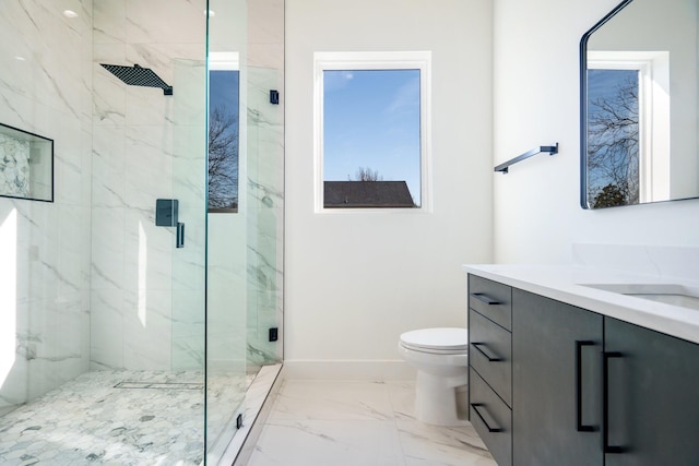 bathroom featuring toilet, walk in shower, and vanity