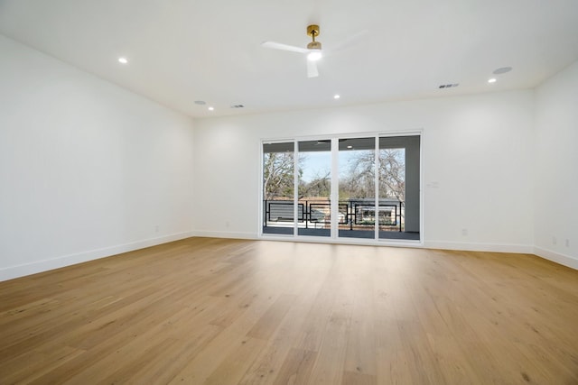 unfurnished room featuring ceiling fan and light wood-type flooring