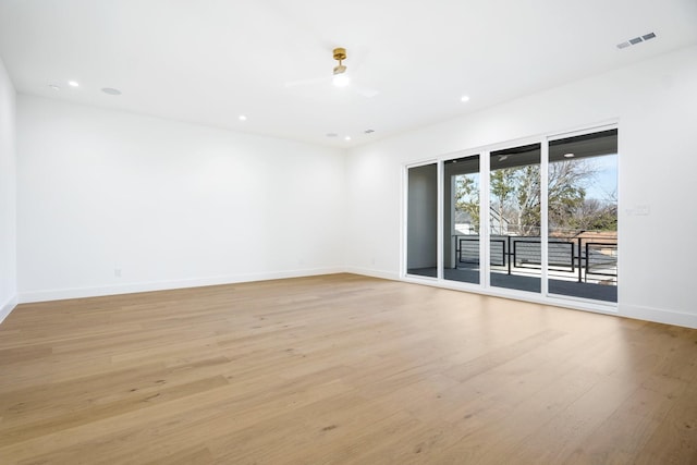 unfurnished room featuring light hardwood / wood-style floors and ceiling fan