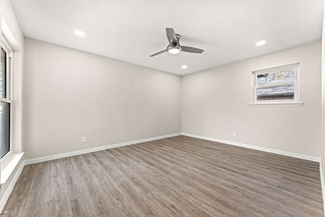 empty room with wood-type flooring and ceiling fan