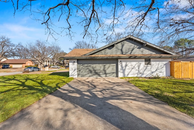 view of home's exterior featuring a garage and a lawn