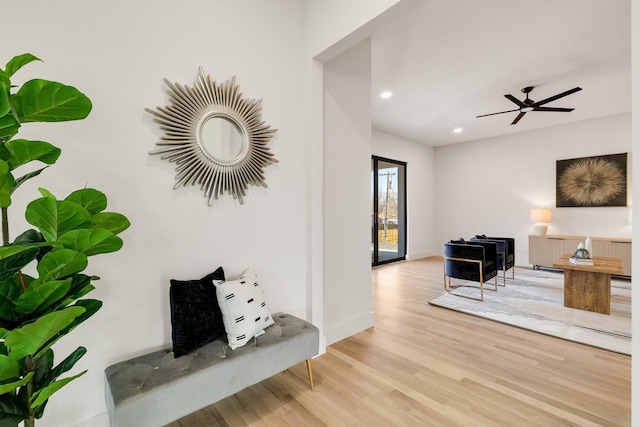 interior space featuring ceiling fan and light wood-type flooring