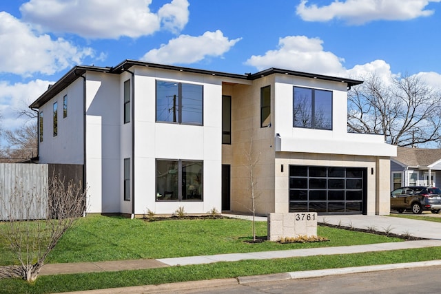 modern home with a garage and a front yard