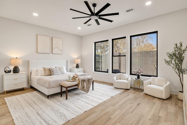 bedroom featuring ceiling fan and light hardwood / wood-style floors