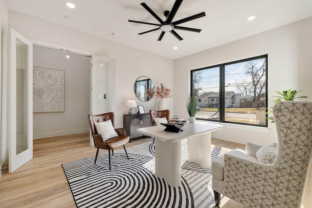 interior space with ceiling fan and light wood-type flooring