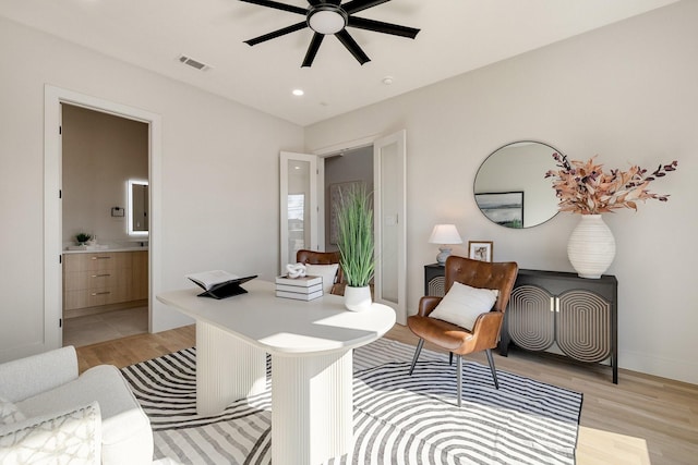 office featuring ceiling fan and light wood-type flooring