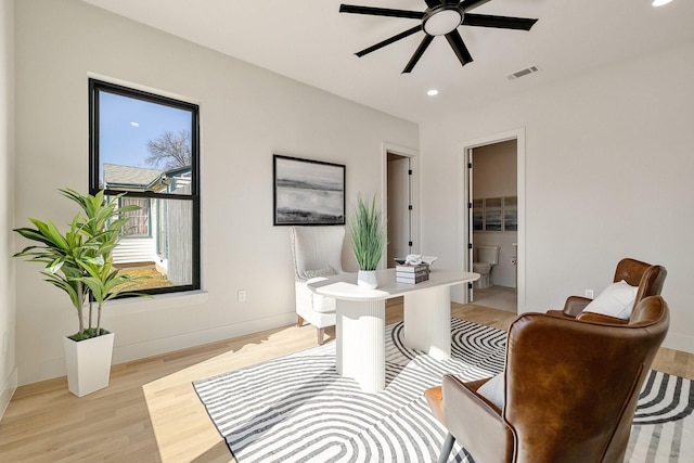 sitting room featuring ceiling fan and light hardwood / wood-style flooring