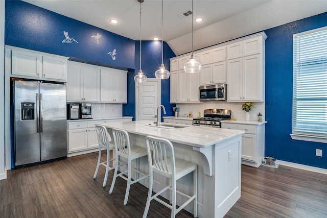 kitchen featuring sink, white cabinetry, and appliances with stainless steel finishes