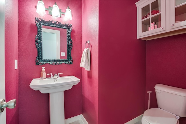 bathroom with sink and toilet