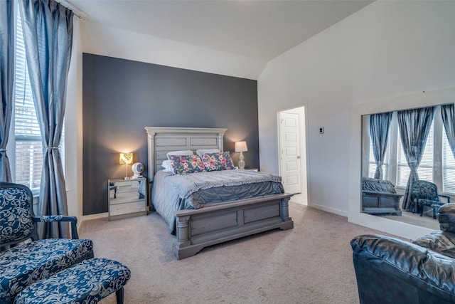 carpeted bedroom featuring vaulted ceiling