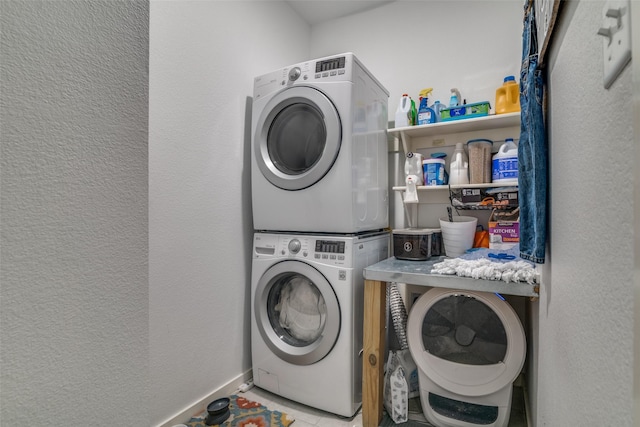 laundry room featuring stacked washer and dryer