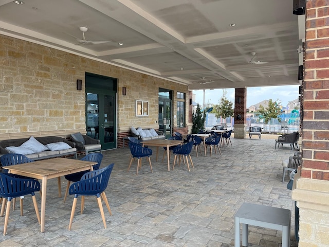 view of patio featuring ceiling fan