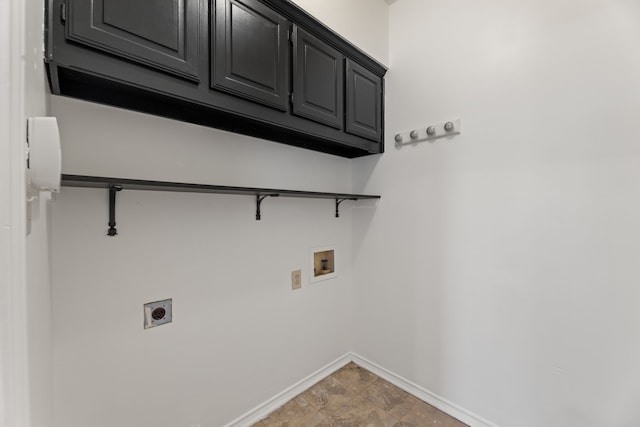 clothes washing area featuring electric dryer hookup, cabinets, and hookup for a washing machine