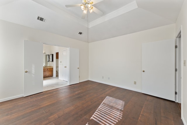 empty room with ceiling fan, ornamental molding, lofted ceiling, and dark hardwood / wood-style flooring