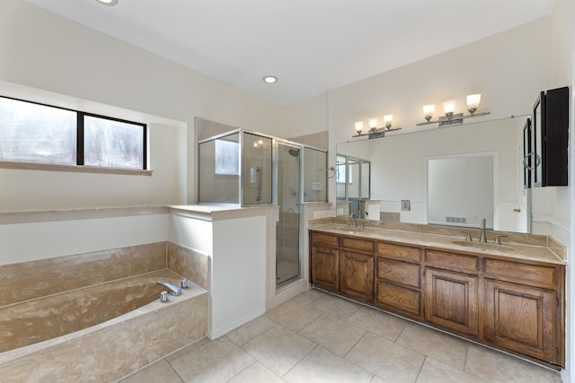 bathroom featuring vanity, separate shower and tub, and tile patterned flooring