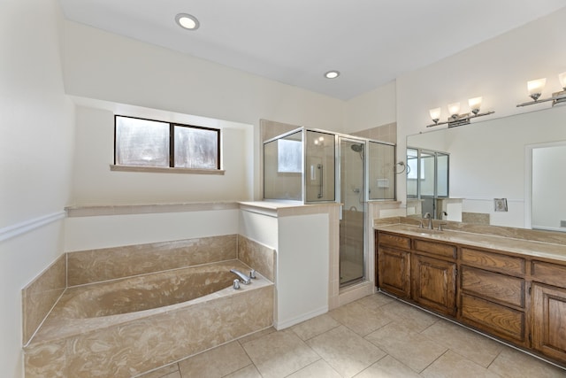 bathroom featuring plus walk in shower, tile patterned flooring, and vanity