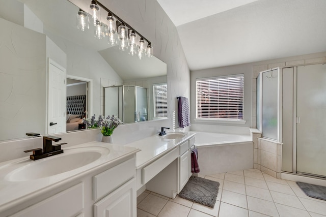 bathroom featuring a wealth of natural light, tile patterned flooring, and lofted ceiling