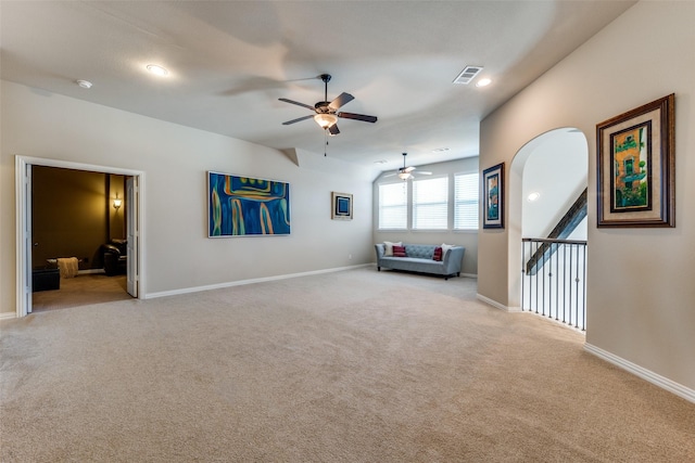 unfurnished living room featuring light carpet