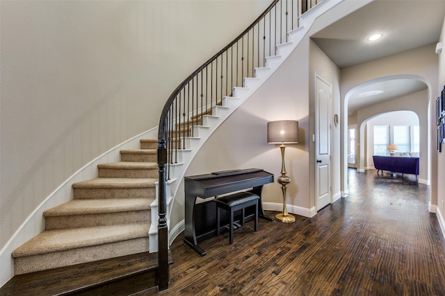 stairs with hardwood / wood-style floors