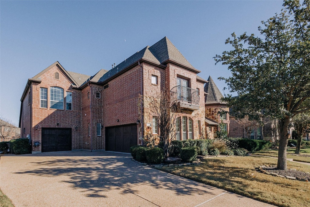 exterior space featuring a balcony and a garage