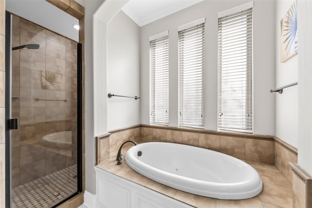 bathroom with plenty of natural light, a shower stall, crown molding, and a bath